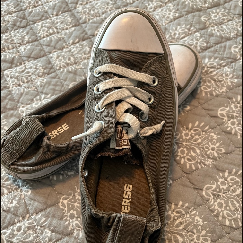Converse ALL Star slip on shoes with lace accent.